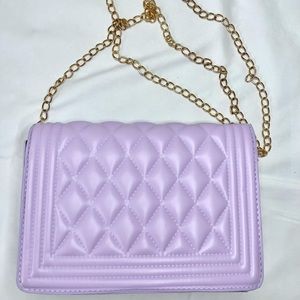 Purple quilted cross body bag.